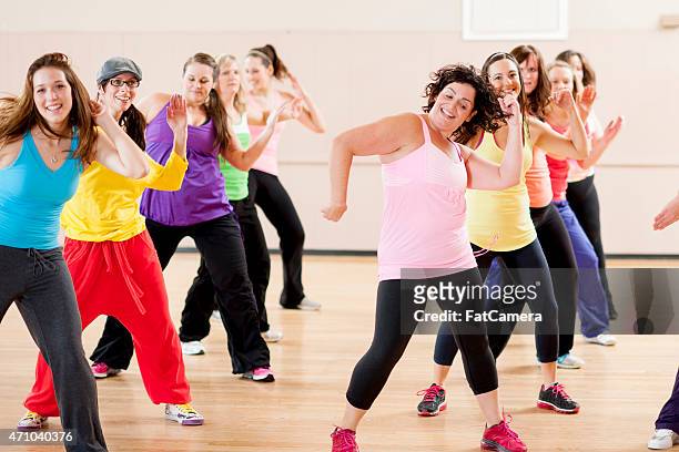 female adult dance - zumba stock pictures, royalty-free photos & images