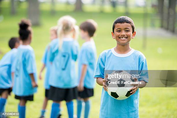 little kids soccer league - black football player stock pictures, royalty-free photos & images