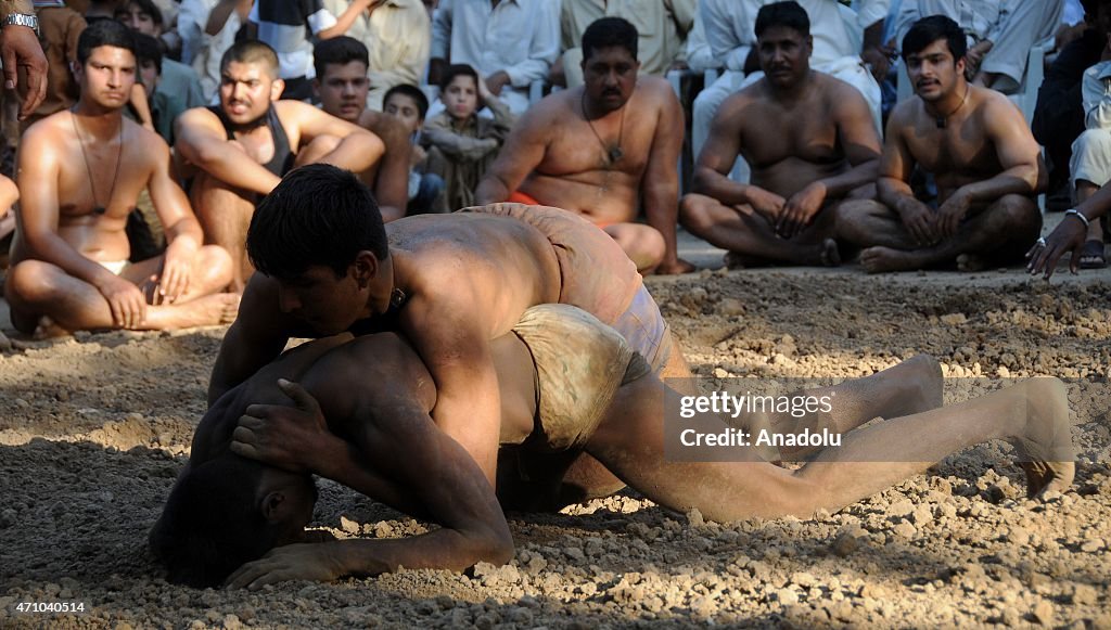 Traditional wrestlers compete during a tournament in Rawalpindi