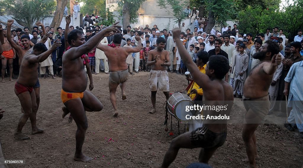Traditional wrestlers compete during a tournament in Rawalpindi