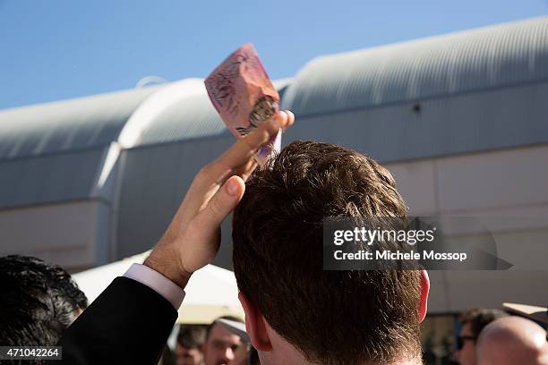 Day - Crowds at the Australian Hotel Rocks to play two Up on April 25, 2015 in Sydney, Australia. 2 Pennies are placed on a paddle and tossed in the...