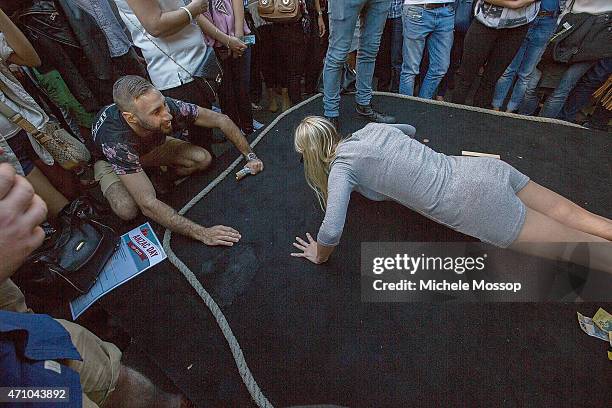 Day - Crowds at the Glenmore Hotel in the Rocks to play two Up on April 25, 2015 in Sydney, Australia. 2 Pennies are placed on a paddle and tossed in...