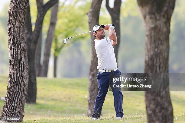 Alexander Levy of France plays a shot during the day three of the Volvo China Open at Tomson Shanghai Pudong Golf Club on April 25, 2015 in Shanghai,...