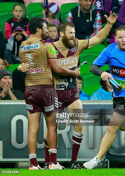David Williams of the Sea Eagles is congratulated by Peta Hiku and his teammates after scoring a try during the round eight NRL match between the...