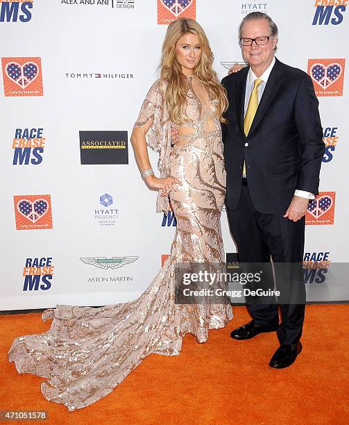Paris Hilton and dad Rick Hilton arrive at the 22nd Annual Race To Erase MS at the Hyatt Regency Century Plaza on April 24, 2015 in Century City,...