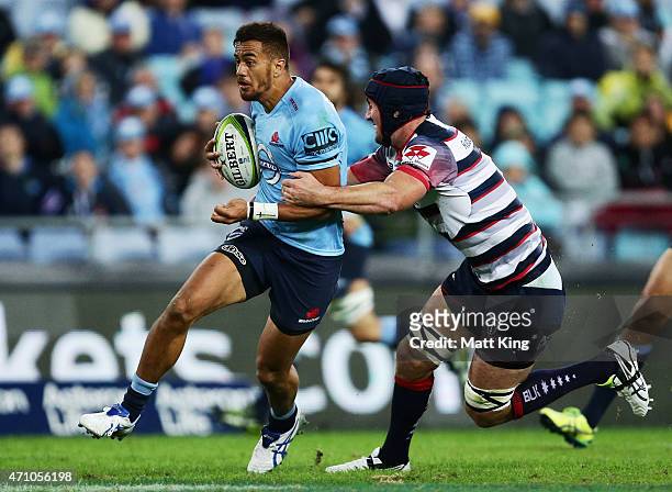 Peter Betham of the Waratahs makes a break during the round 11 Super Rugby match between the Waratahs and the Rebels at ANZ Stadium on April 25, 2015...