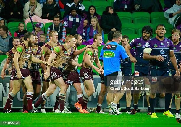 David Williams of the Sea Eagles is congratulated by Daly Cherry-Evans and his teammates after scoring a try during the round eight NRL match between...