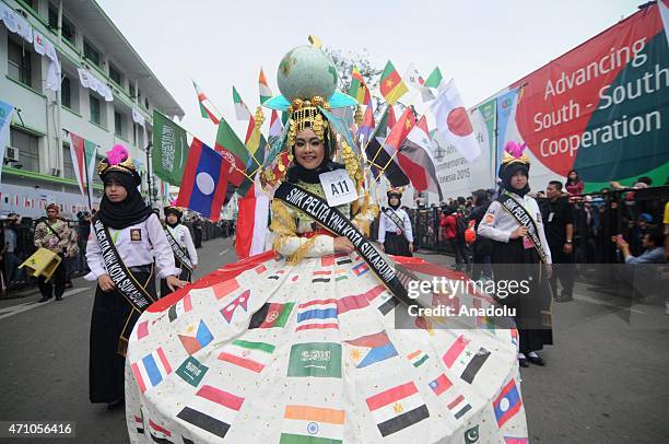 Woman wearing costumes with national flags of participant countries attend the Asian-African Carnival in Bandung, West Java, Indonesia on April 25....