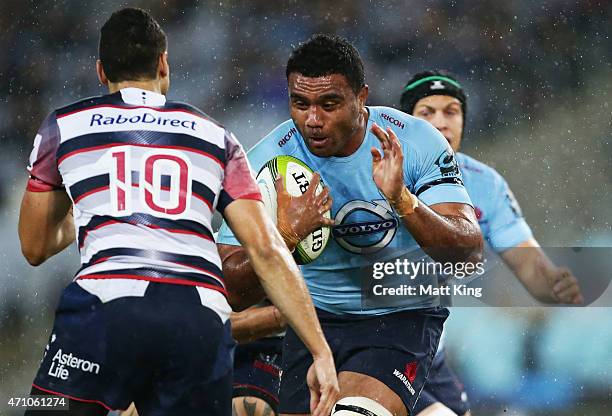 Wycliff Palu of the Waratahs takes on the defence during the round 11 Super Rugby match between the Waratahs and the Rebels at ANZ Stadium on April...