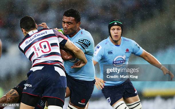 Wycliff Palu of the Waratahs takes on the defence during the round 11 Super Rugby match between the Waratahs and the Rebels at ANZ Stadium on April...