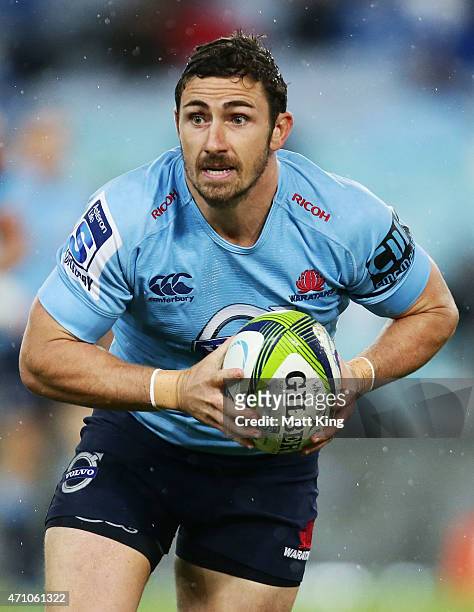 Brendan McKibbin of the Waratahs runs with the ball during the round 11 Super Rugby match between the Waratahs and the Rebels at ANZ Stadium on April...