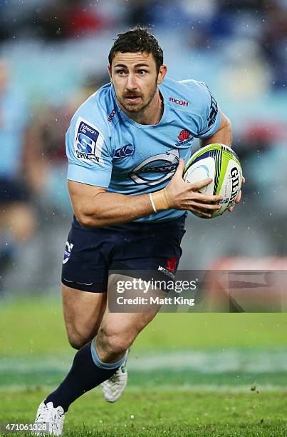 Brendan McKibbin of the Waratahs runs with the ball during the round 11 Super Rugby match between the Waratahs and the Rebels at ANZ Stadium on April...