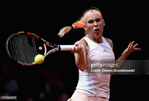 Caroline Wozniacki of Denmark plays a forehand in her semi final match against Simona Halep of Romania during Day 6 of the Porsche Tennis Grand Prix...