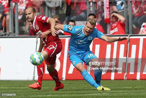 Leonhard Kaufmann of Cottbus battles for the ball with Fabio Leutenecker of Stuttgart during the third league match between FC Energie Cottbus and SV...