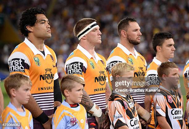 Josh McGuire of the Broncos and team mates line up for the ANZAC Day ceremonies before the round eight NRL match between the Brisbane Broncos and the...