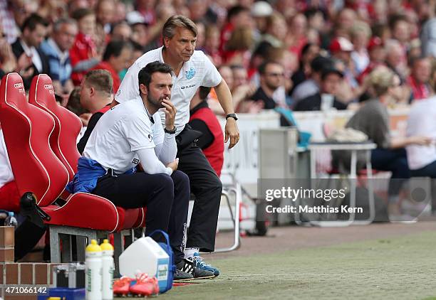 Head coach Horst Steffen of Stuttgart and assistant coach Sreto Ristic look on during the third league match between FC Energie Cottbus and SV...