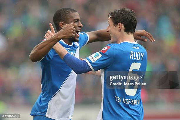 Anthony Modeste of Hoffenheim celebrates with his team mate Sebastian Rudy after scoring his team's first goal during the Bundesliga match between...