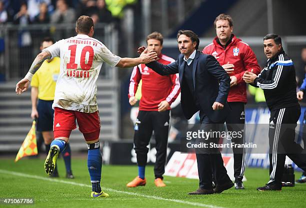 Pierre-Michel Lasogga of Hamburg celebrates scoring his goal with Bruno Labbadia, head coach of Hamburg during the Bundeslga match between Hamburger...