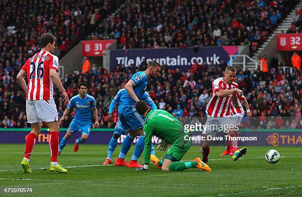 Connor Wickham of Sunderland scores the opening goal past Asmir Begovic of Stoke City during the Barclays Premier League match between Stoke City and...