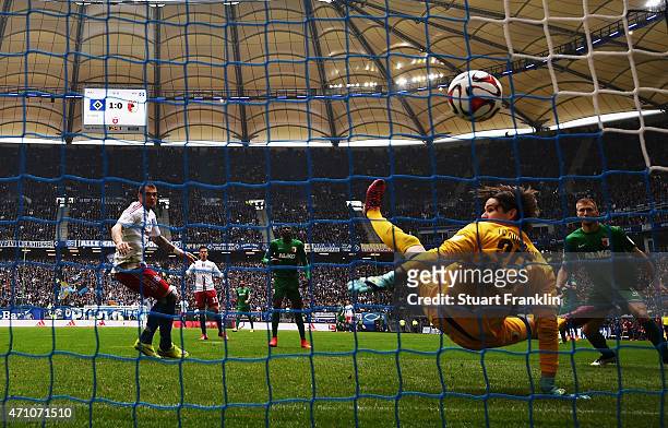 Pierre-Michel Lasogga of Hamburg scores his goal during the Bundeslga match between Hamburger SV and FC Augsburg at Imtech Arena on April 25, 2015 in...