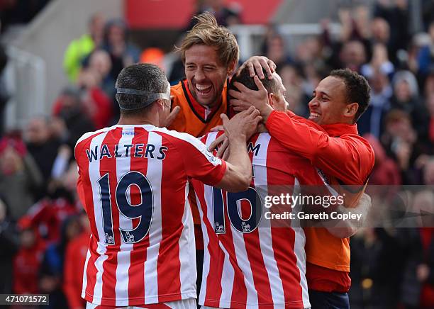 Charlie Adam of Stoke City celebrates scoring their first goal with Peter Crouch,Peter Odemwingie and Jonathan Walters of Stoke City during the...