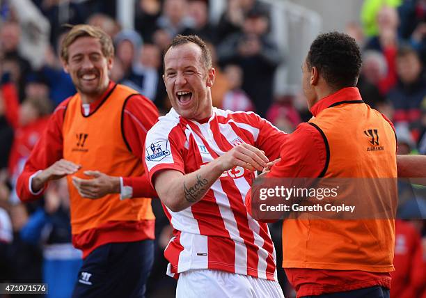 Charlie Adam of Stoke City celebrates scoring their first goal with Peter Crouch and Peter Odemwingie of Stoke City during the Barclays Premier...