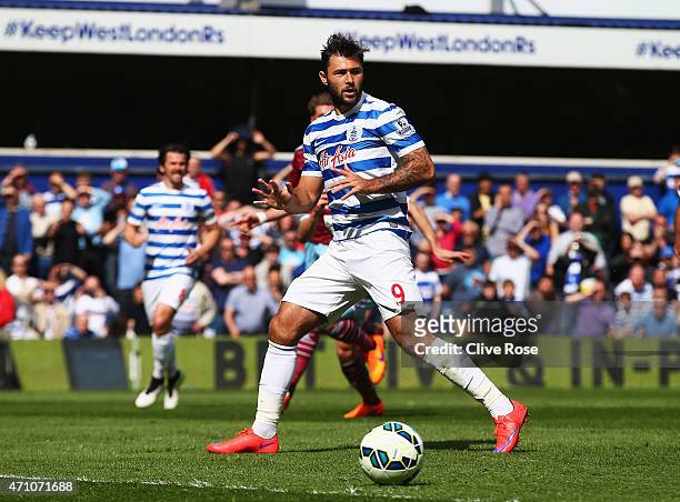 Charlie Austin of QPR reacts after missing a pnalty during the Barclays Premier League match between Queens Park Rangers and West Ham United at...