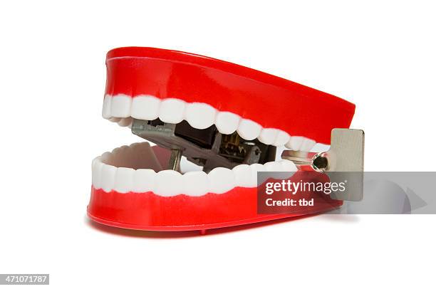 chattering teeth - clockwork stock pictures, royalty-free photos & images