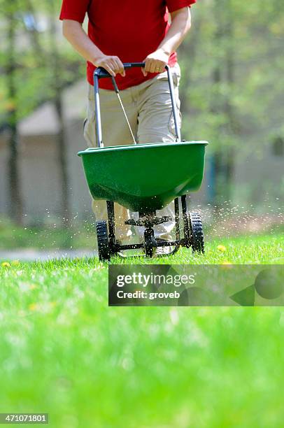 spring lawn care - lawn fertilizer stock pictures, royalty-free photos & images