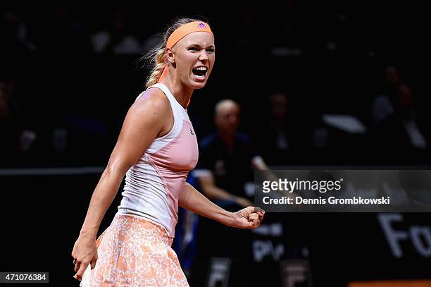 Caroline Wozniacki of Denmark celebrates after her victory in her semi final match against Simona Halep of Romania during Day 6 of the Porsche Tennis...