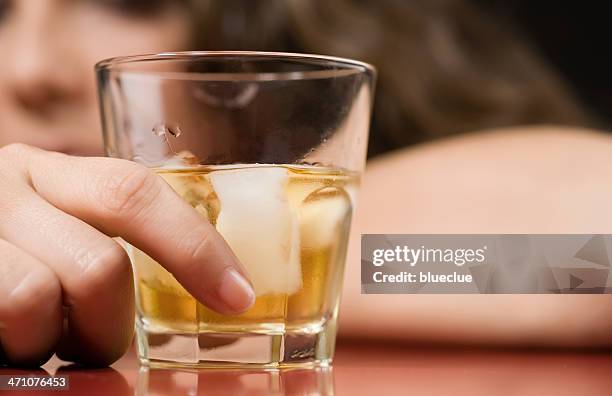 alcohol and sorrow - alcoholism stock pictures, royalty-free photos & images