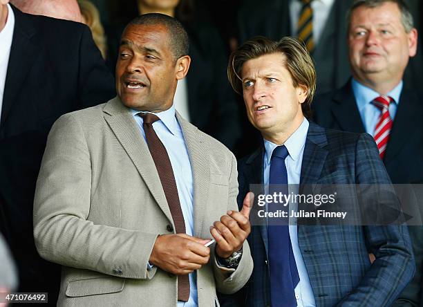 Former Palace player, Mark Bright talks to Crystal Palace co-owner Steve Parish during the Barclays Premier League match between Crystal Palace and...