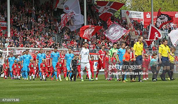 The teams of Cottbus and Stuttgart enter the pitch during the third league match between FC Energie Cottbus and SV Stuttgarter Kickers at Stadion der...