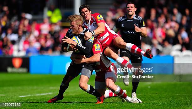 Falcons centre Chris Harris is stopped by James Hook of Gloucester during the Aviva Premiership match between Gloucester Rugby and Newcastle Falcons...