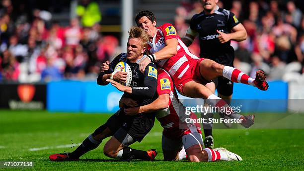 Falcons centre Chris Harris is stopped by James Hook of Gloucester during the Aviva Premiership match between Gloucester Rugby and Newcastle Falcons...