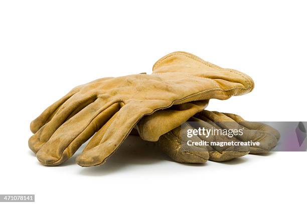 a pair of used, yellow work gloves - leather glove bildbanksfoton och bilder