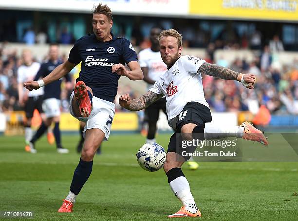 Lee Martin of Millwall and Johnny Russell of Derby County in action during the Sky Bet Championship match between Millwall and Derby County at The...