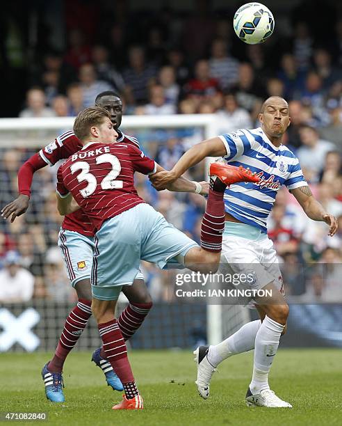 West Ham United's English defender Reece Burke vies with Queens Park Rangers English striker Bobby Zamora during the English Premier League football...