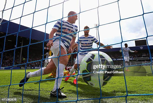 Richard Dunne and Charlie Austin of QPR celebrate a goal that was disallowed during the Barclays Premier League match between Queens Park Rangers and...