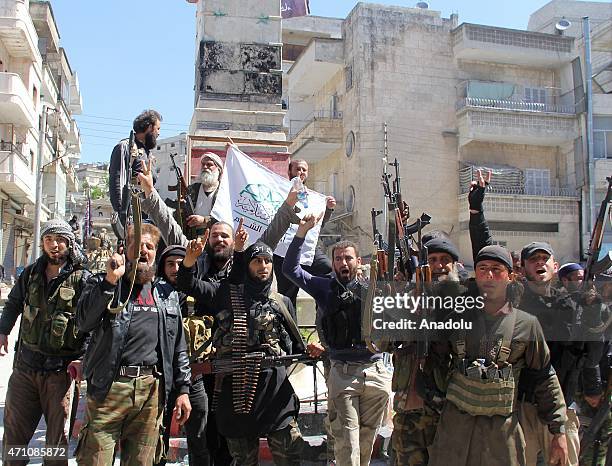 Armed Syrian opponents are seen after they seized the control of the Jisr al-Shughur town in Idlib, Syria on April 25, 2015. Syrian opponents carried...