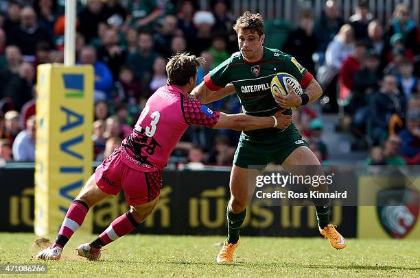 Blaine Scully of Leicester Tigers is tackled by Will Robinson of London Welsh defence during the Aviva Premiership match between Leicester Tigers and...