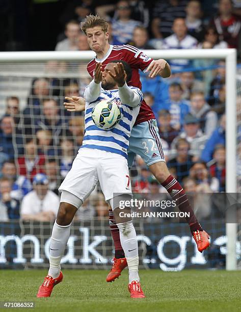 Queens Park Rangers Scottish midfielder Matt Phillips vies with West Ham United's English defender Reece Burke during the English Premier League...