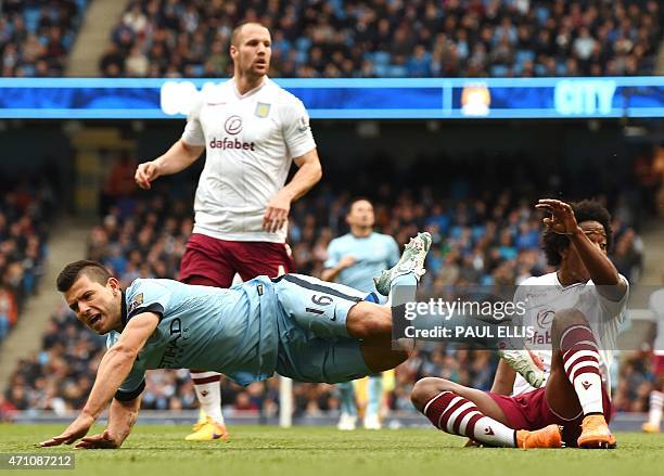 Manchester City's Argentinian striker Sergio Aguero is tackled by Aston Villa's Colombian midfielder Carlos Sanchez during the English Premier League...