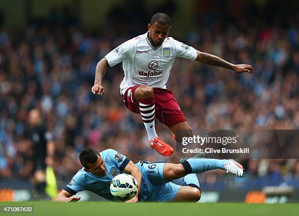 Leandro Bacuna of Aston Villa skips a challenge from Sergio Aguero of Manchester City during the Barclays Premier League match between Manchester...