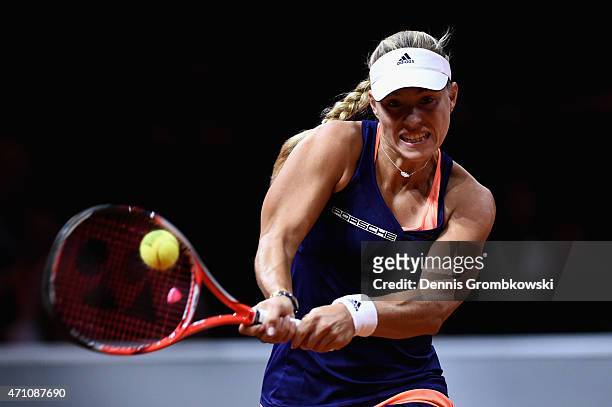 Angelique Kerber of Germany plays a backhand in her semi final match against Madison Brengle of the United States during Day 6 of the Porsche Tennis...