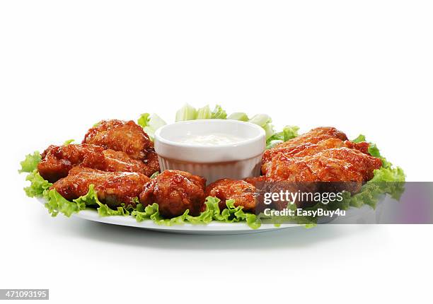 chicken wings served on a plate with a dip  - chicken wings plate stock pictures, royalty-free photos & images