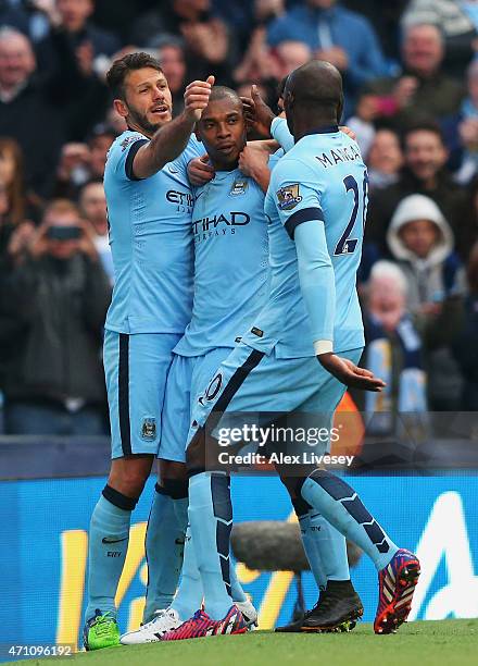 Fernandinho of Manchester City celebrates his winning goal with Martin Demichelis and Eliaquim Mangala of Manchester City during the Barclays Premier...