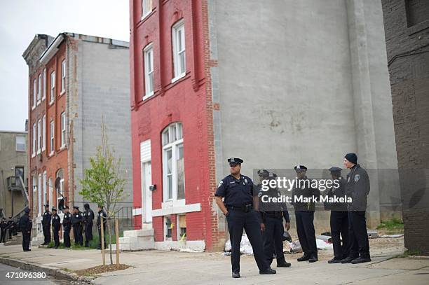 Baltimore Police officers gather near the Western District Police Station in anticipation of a protest in honor of Freddie Gray April 25, 2015 in...