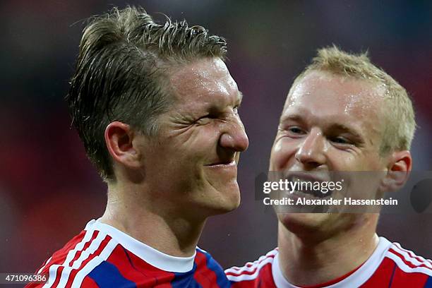 Bastian Schweinsteiger of Muenchen celebrates with his team mate Sebastian Rode after the Bundesliga match between FC Bayern Muenchen and Hertha BSC...