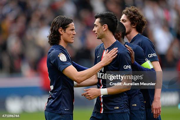 Edinson Cavani and Javier Pastore of PSG reacts after Edinson Cavani scored his second goal of PSG during the Ligue 1 game between Paris Saint...